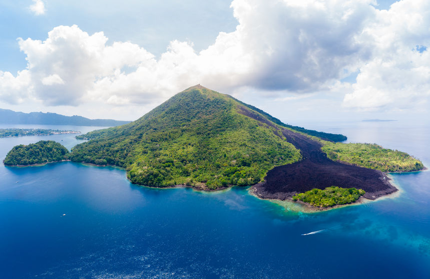 Aerial view Banda Islands Moluccas archipelago Indonesia, Pulau Gunung Api, lava flows, coral reef. Top travel tourist destination, best diving snorkeling.